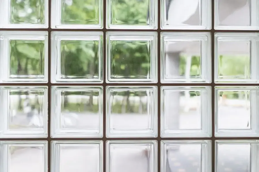Grid pattern of glass block windows on a commercial building facade